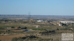 Finca en la huerta de Caspe con masía de piedra. en oferta con olivos por 19.000€